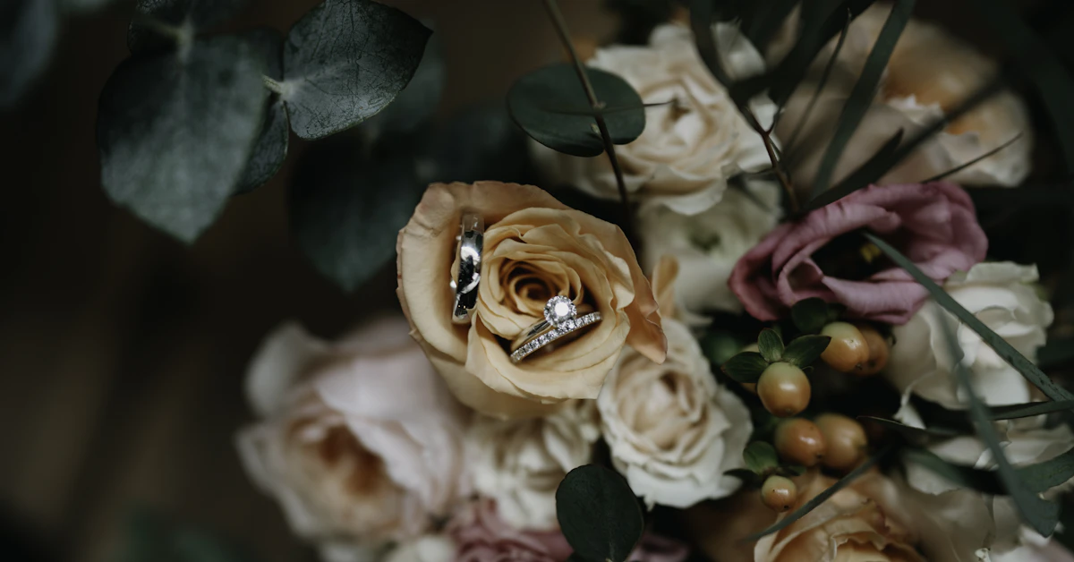 a bouquet of flowers with a wedding ring on it
