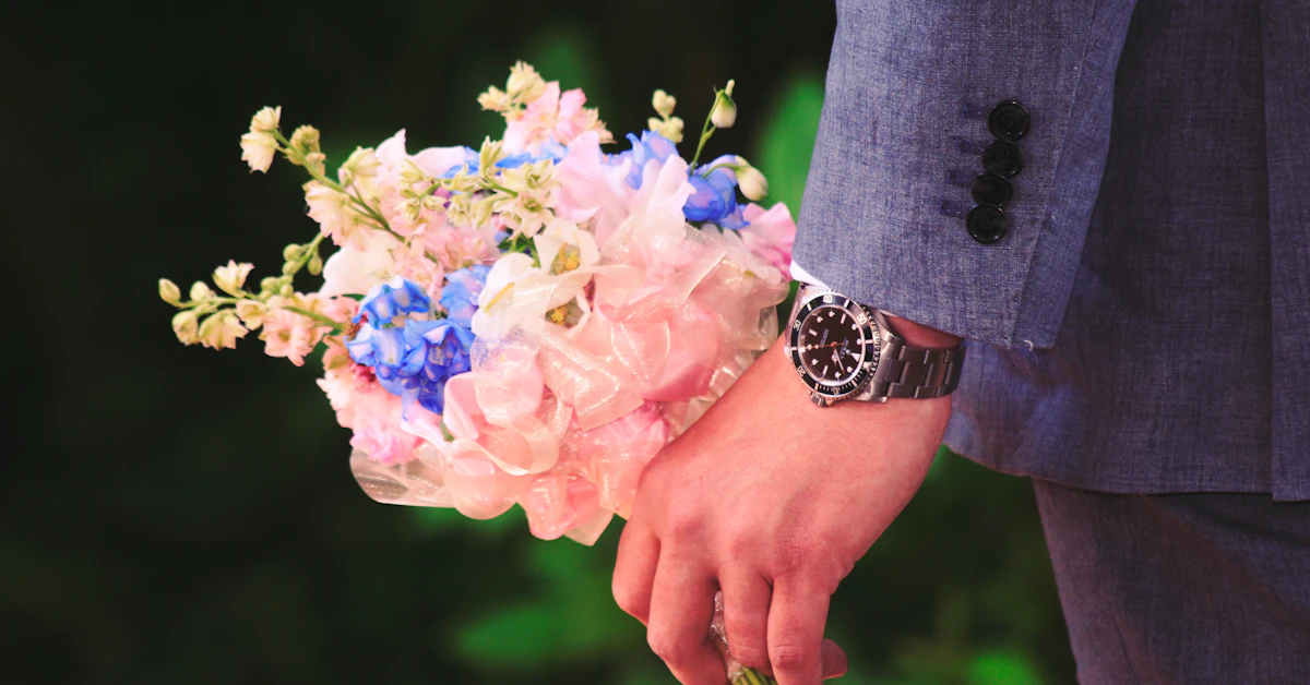 close up photography of man holding flowers