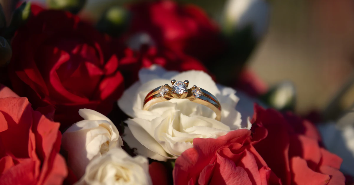 a couple of wedding rings sitting on top of a bouquet of flowers