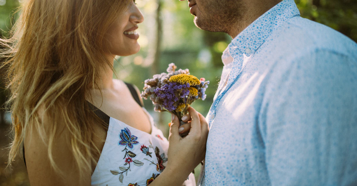 man and woman facing each other while holding flowers