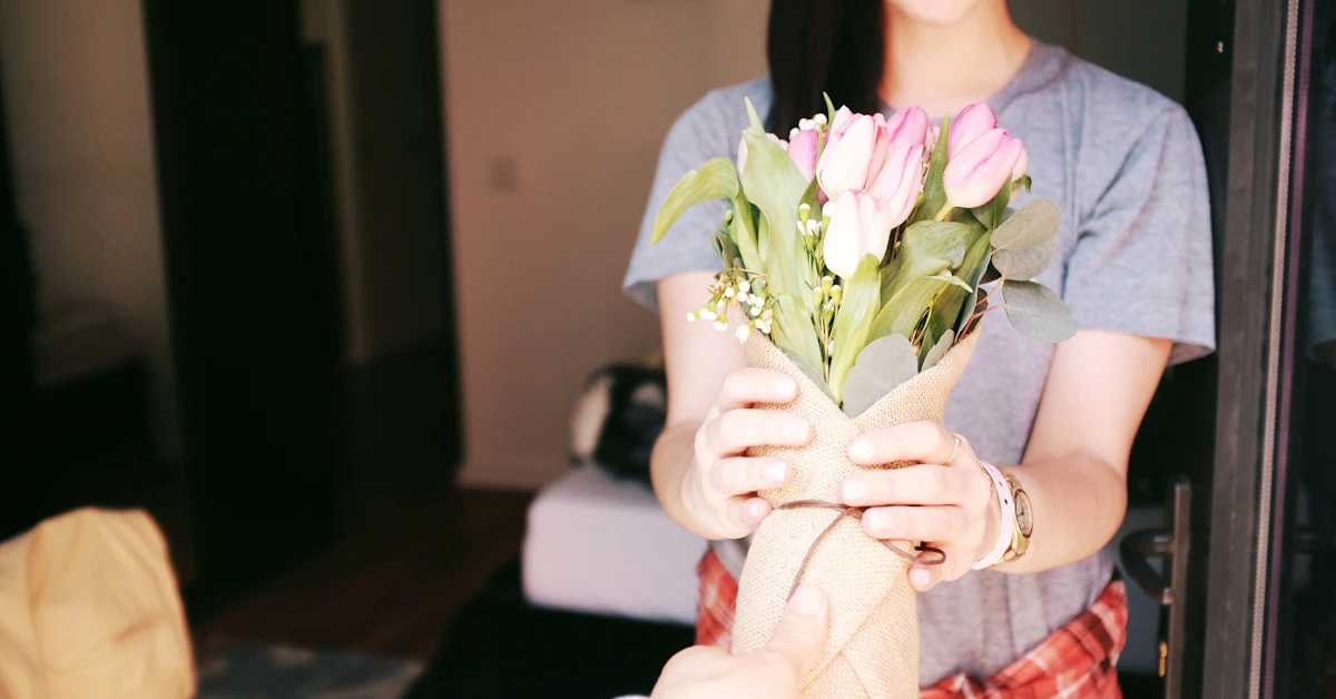 woman holding flower bouquets